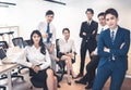 Group portrait of smiling diverse young business people posing together in modern office Royalty Free Stock Photo