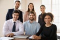 Portrait of young multiracial team posing in office Royalty Free Stock Photo