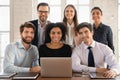 Portrait of smiling diverse employees working on laptop Royalty Free Stock Photo