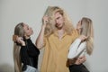 Group portrait of young people combing hair. Attractive cheerful sexy, fashionable group models combing hair Royalty Free Stock Photo