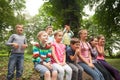 Group of children on a park bench Royalty Free Stock Photo