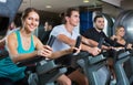 Group positive working out of cycling in fitness club