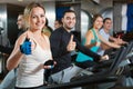 Group positive working out of cycling in fitness club