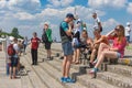 Group of positive young people having rest on the Dnepr river embankment Royalty Free Stock Photo