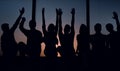 Group of positive young people sitting on a windowsill. Royalty Free Stock Photo