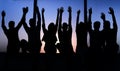 Group of positive young people sitting on a windowsill. Royalty Free Stock Photo