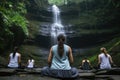 group practicing yoga near a waterfall Royalty Free Stock Photo