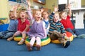 Group Of Pre School Children Answering Question In Classroom Royalty Free Stock Photo