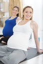 group pregnant women meditating on yoga class