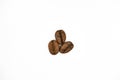Group of premium dark-roasted coffee beans isolated on a white background. Royalty Free Stock Photo