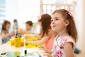 Group of preschool children engaged in drawing and crafts