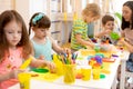 Group of preschool children engaged in handcrafts Royalty Free Stock Photo