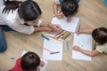 Group of preschool student and teacher drawing on paper in art class. Back to school and Education concept. People and lifestyles