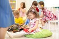 Group of preschooler kids play with musical toys at kindergarten Royalty Free Stock Photo