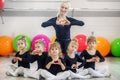 A group of preschoolers and a trainer in dance classes. The concept of sport, education, childhood, hobbies and dance Royalty Free Stock Photo