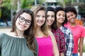 Group of pretty international girls standing in line Royalty Free Stock Photo