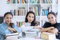 Group of pretty teenagers studying in the library Royalty Free Stock Photo