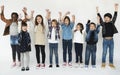 A group of primary schoolers cheering Royalty Free Stock Photo