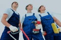 Group of professional industrial workers. Isolated over white background. Royalty Free Stock Photo