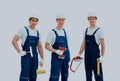 Group of professional industrial workers. Isolated over white background. Royalty Free Stock Photo