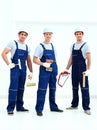 Group of professional industrial workers. Isolated over white background. Royalty Free Stock Photo