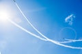 A group of professional pilots of military aircraft of fighters on a sunny clear day shows tricks in the blue sky, leaving beauti Royalty Free Stock Photo