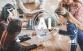 Group of Professionals Collaborating on Artificial Intelligence Project with Charts, Technology Icons, and Data Royalty Free Stock Photo