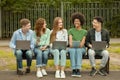 Group Project. Multiracial College Students Studying Outdoors With Laptops And Digital Tablet Royalty Free Stock Photo