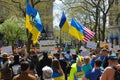 Group of protestants gathered at Bowling Green Park in New York City showing Solidarity with Ukraine