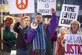 Group Of Protestors With Placards And Megaphone On Anti War Demonstration March Royalty Free Stock Photo