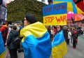 Group of protestors with signs and Ukrainian flags in Time Square, New York City Royalty Free Stock Photo