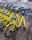 Group of public bicycles parked at street