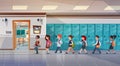 Group Of Pupils Walking In School Corridor To Class Room, Mix Race Schoolchildren