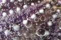 Group of purple air bubbles in water