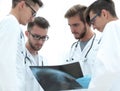 Group of radiologists discussing x-ray Royalty Free Stock Photo