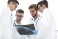 Group of radiologists discussing x-ray Royalty Free Stock Photo