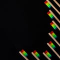 Group of rainbow eco bamboo toothbrushes, on black background. Royalty Free Stock Photo