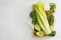 Group of raw green vegetables avocado, asparagus, spinach, letuce, celery. Copy space. Top view Royalty Free Stock Photo