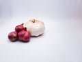 group raw of red onion and garlic with negative space