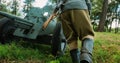 Group Of Re-enactors Dressed As Russian Soviet Red Army Infantry Soldiers Of World War Ii Are Move Soviet 45mm Anti-tank