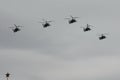 A group of reconnaissance and attack helicopters Ka-52 Alligator Hokum B fly in the sky over Red Square during an air parade ded Royalty Free Stock Photo