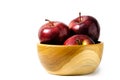 Group of red Apple above wooden bowl / basket isolated on white background Royalty Free Stock Photo