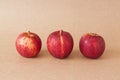 Group of red apples on brown paper background Royalty Free Stock Photo