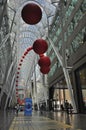 A group of red balls is installed on the atrium of an office building. RedBall is Ã¢â¬Åthe world`s longest-running street artwork