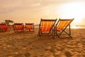 A group of red canvas beds on the beach with sunset atmospher Royalty Free Stock Photo