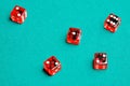 Group of red dices on the green cloth Royalty Free Stock Photo