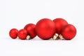 Group of red matt christmas balls on white background