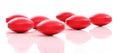 Group of red medicine pills Royalty Free Stock Photo