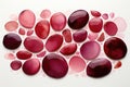 A group of red and pink stones on a white surface. Royalty Free Stock Photo