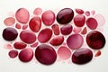 A group of red and pink stones on a white surface Royalty Free Stock Photo